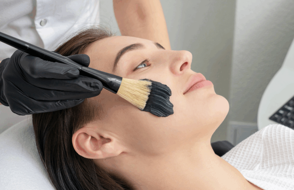 Women having carbon blackhead removal facial