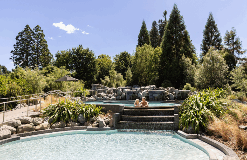 Thermal pools surrounded by alpine scenery at Hanmer Springs, with landscaped gardens and mountain views in the South Island.