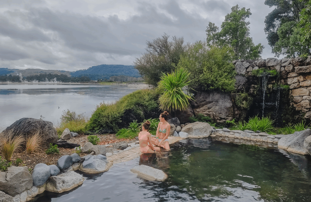 Mineral hot pools at Polynesian Spa in Rotorua with a lakeside setting, steam rising from geothermal waters, and relaxing bathing areas.
