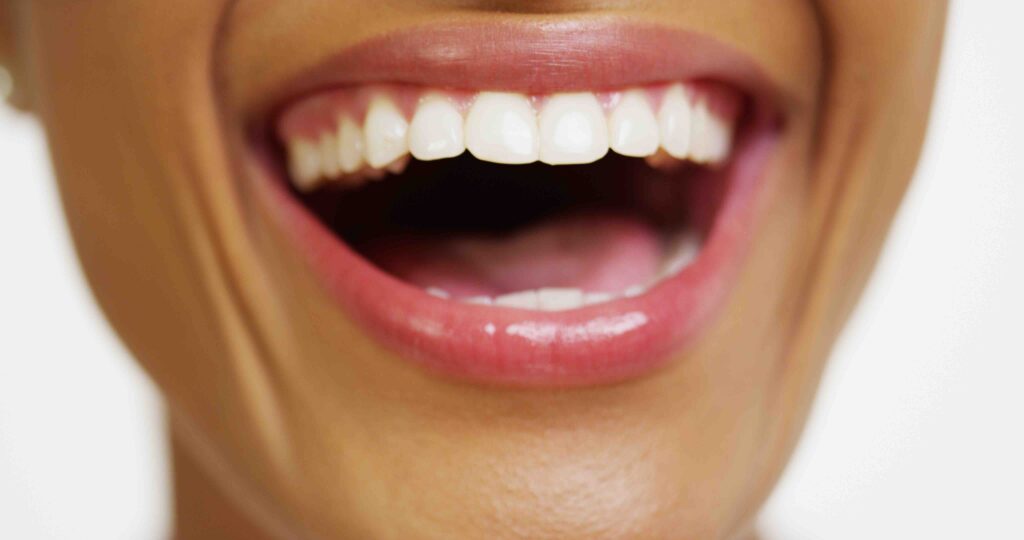 Close Up Of African Woman With White Teeth Smiling