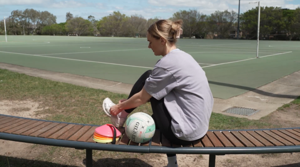 Kiera Austin Tying Her Shoes