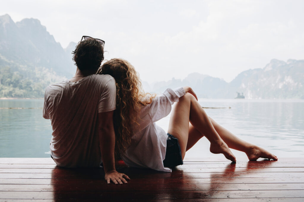 Woman Relaxing In Her Boyfriends Lap